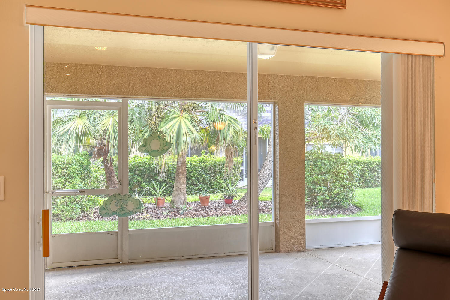 2872 Boddington Way Melbourne, FL 32940 - Photo 7 of 26 Slider to enclosed patio