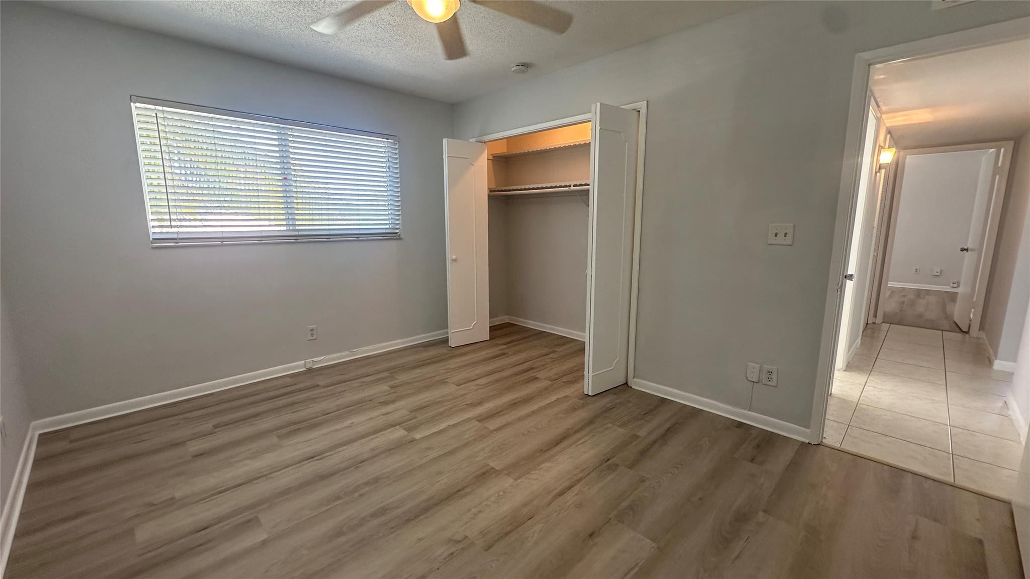 1900 Northeast 29th Street, Unit 2C Lighthouse Point, FL 33064 - Photo 11 of 21 wooden floor in an empty room with a window