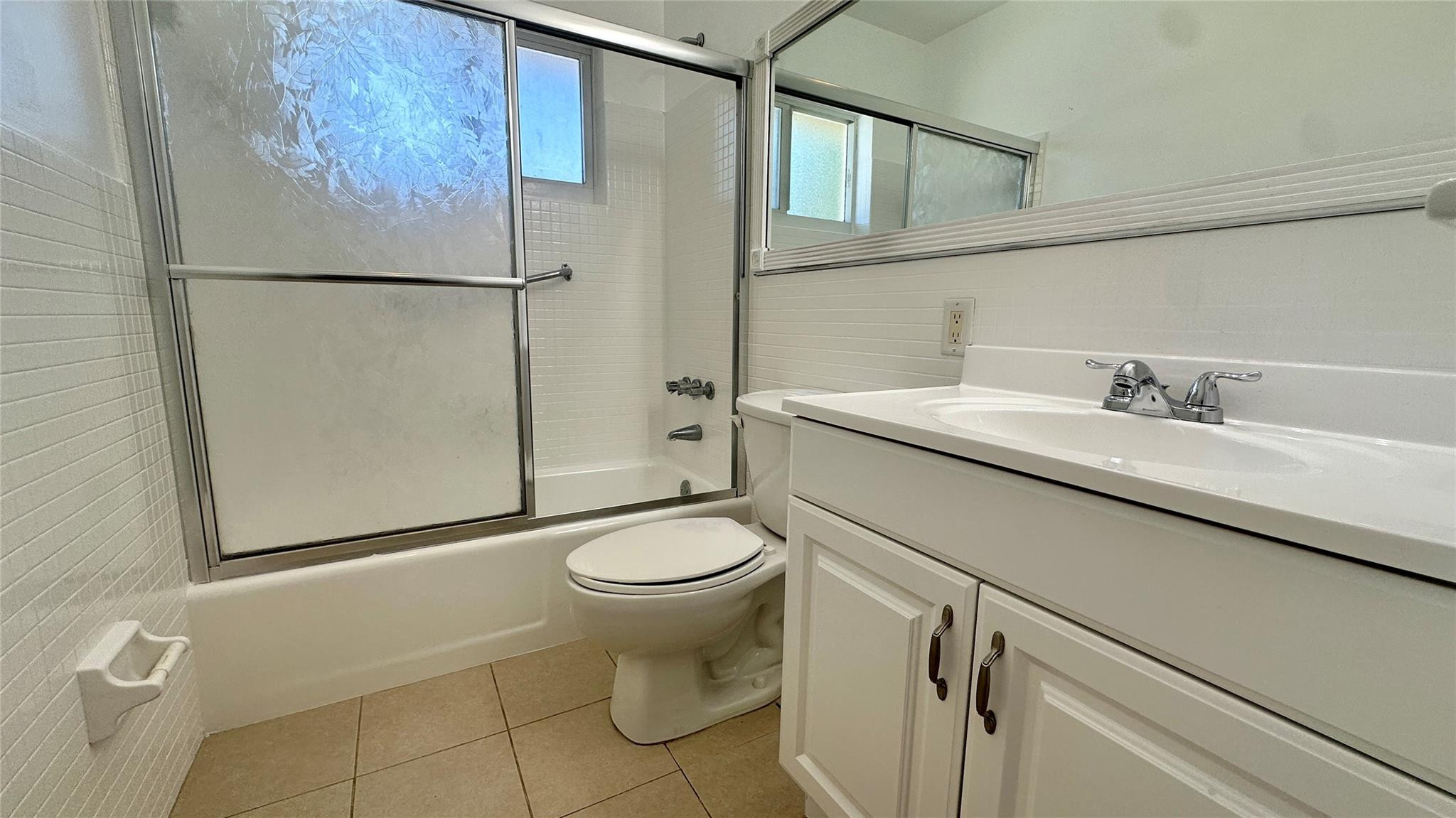 1900 Northeast 29th Street, Unit 2C Lighthouse Point, FL 33064 - Photo 13 of 21 a bathroom with a sink toilet and shower
