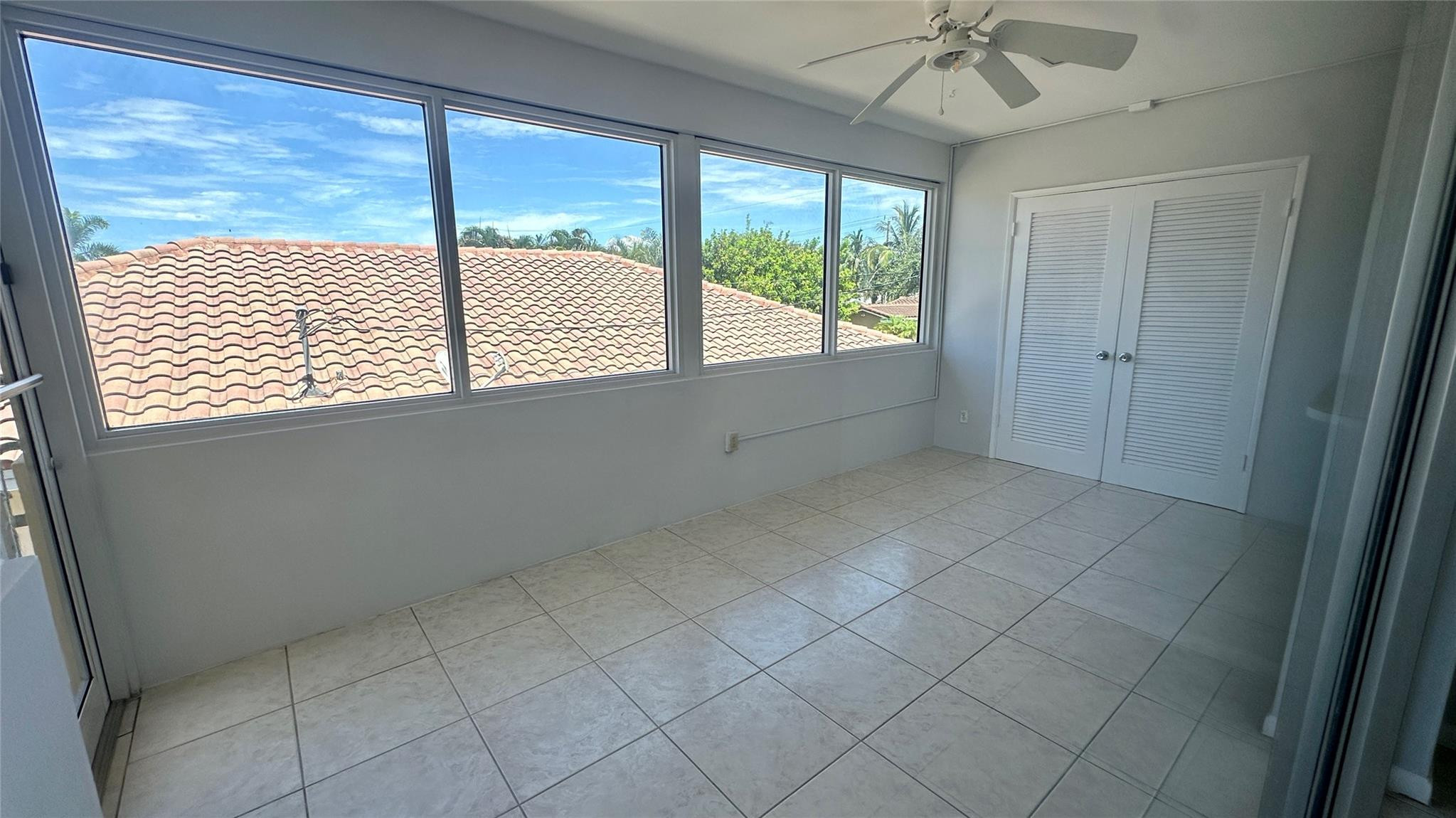 1900 Northeast 29th Street, Unit 2C Lighthouse Point, FL 33064 - Photo 14 of 21 a view of an empty room with a window