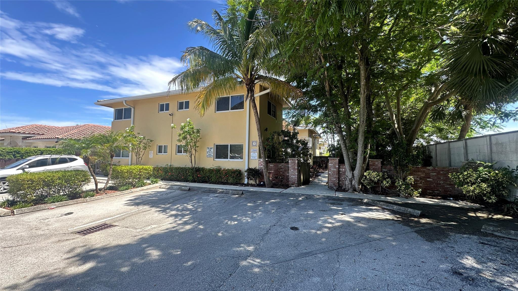 1900 Northeast 29th Street, Unit 2C Lighthouse Point, FL 33064 - Photo 21 of 21 a view of a house with a yard and tree s