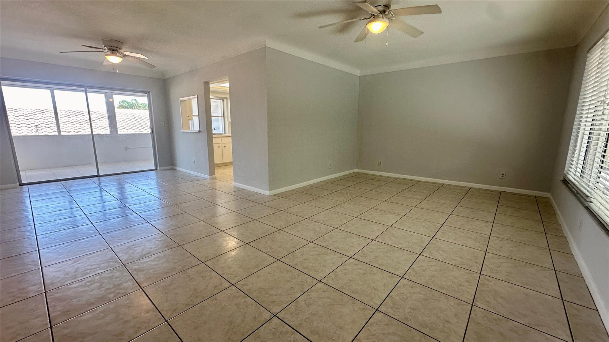 1900 Northeast 29th Street, Unit 2C Lighthouse Point, FL 33064 - Photo 4 of 21 a view of an empty room and window