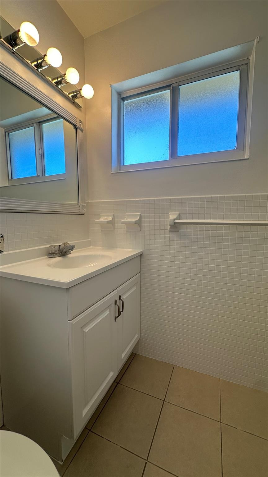 1900 Northeast 29th Street, Unit 2C Lighthouse Point, FL 33064 - Photo 9 of 21 a bathroom with a sink vanity and a toilet