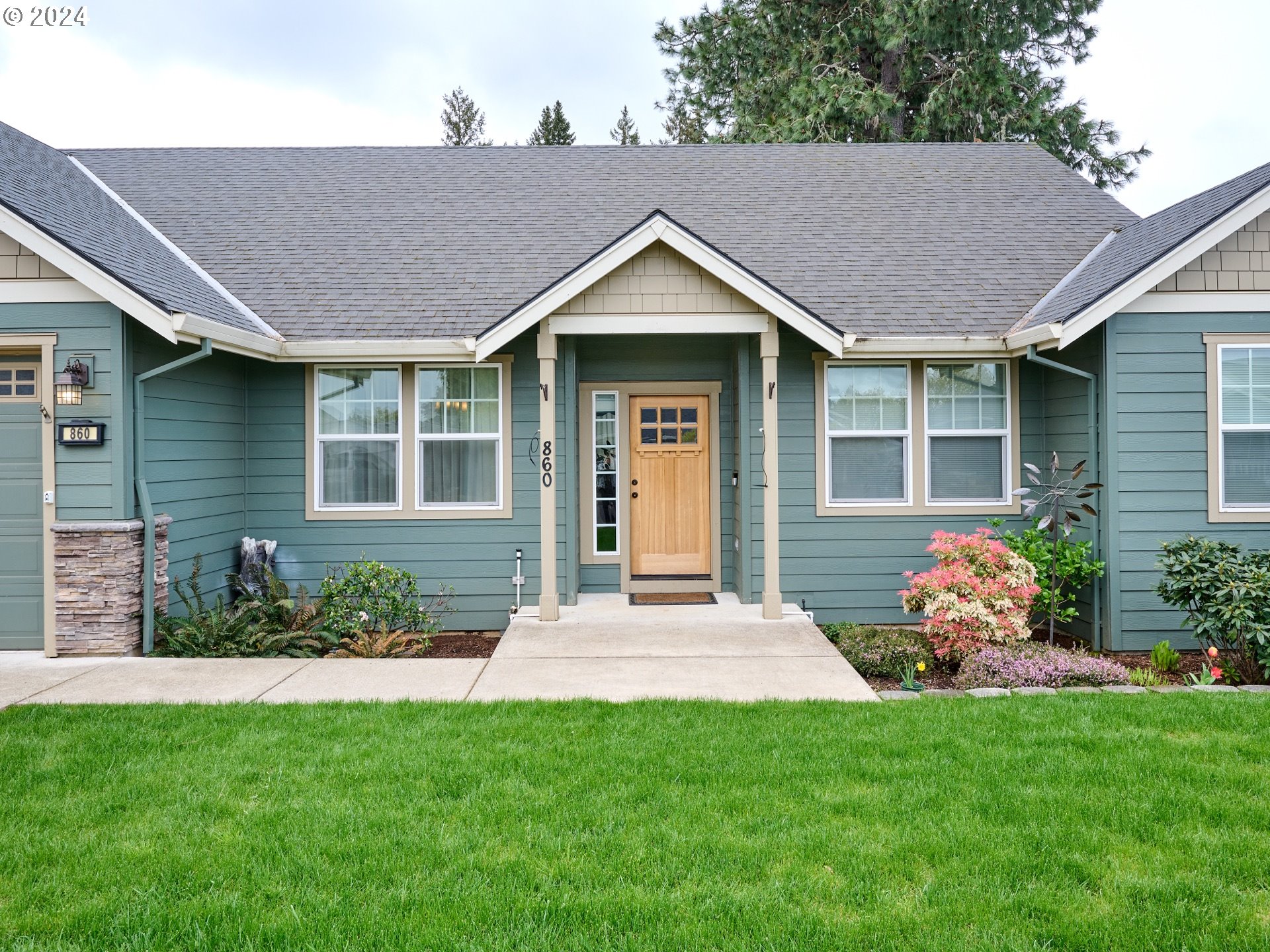 860 Southeast Darrow Road Estacada, OR 97023 - Photo 1 of 6 a front view of a house with garden