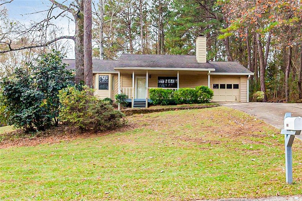 137 Springvalley Circle Stockbridge, GA 30281 - Photo 1 of 1 a front view of a house with a yard and trees