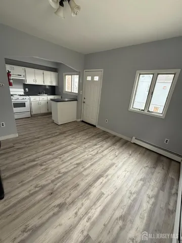 a view of a kitchen with microwave and cabinets