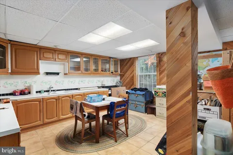 a living room with dining room and kitchen view