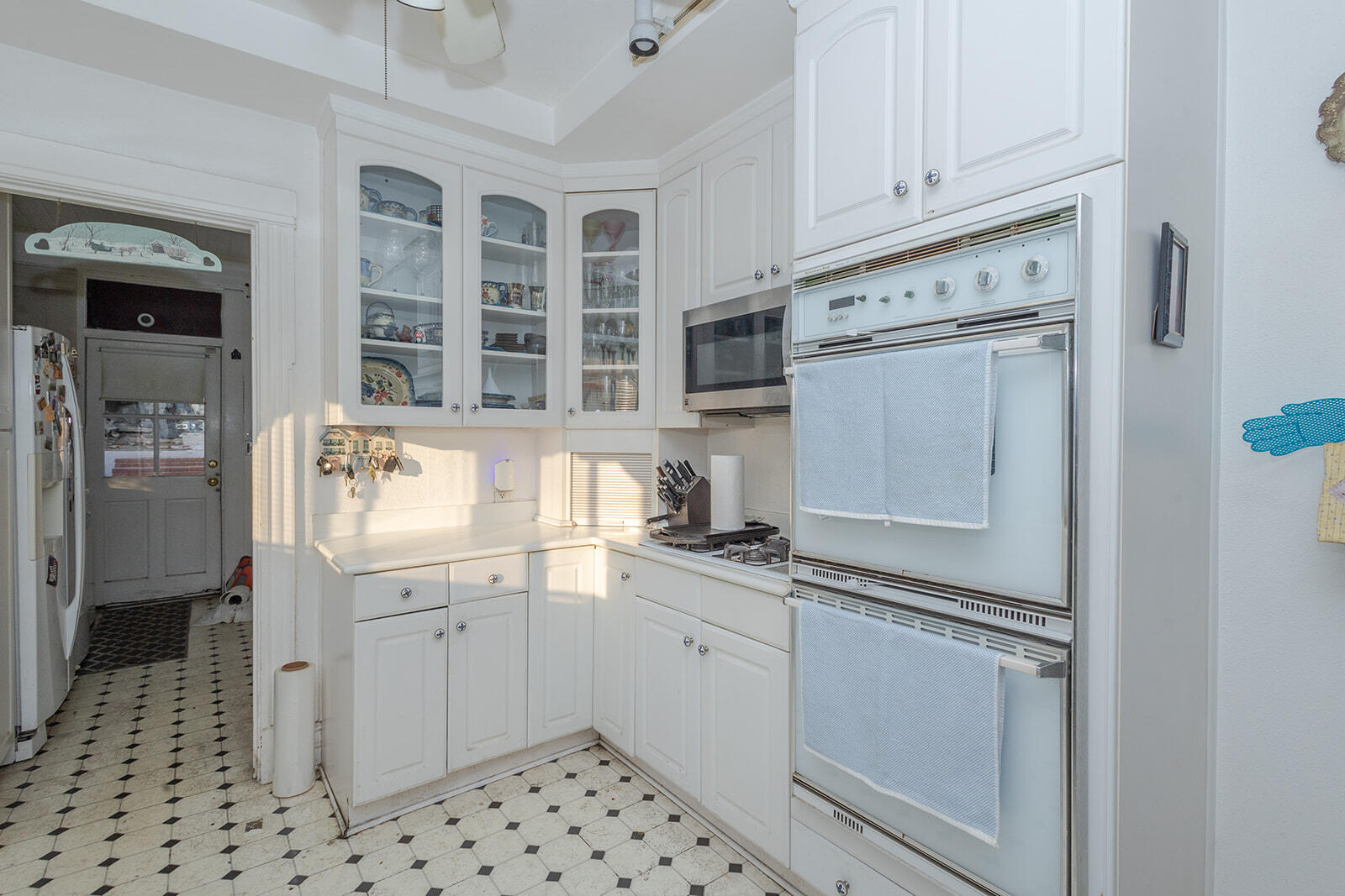 13429 Bailey Street Whittier, CA 90601 - Photo 19 of 54 a kitchen with stainless steel appliances a stove and a refrigerator