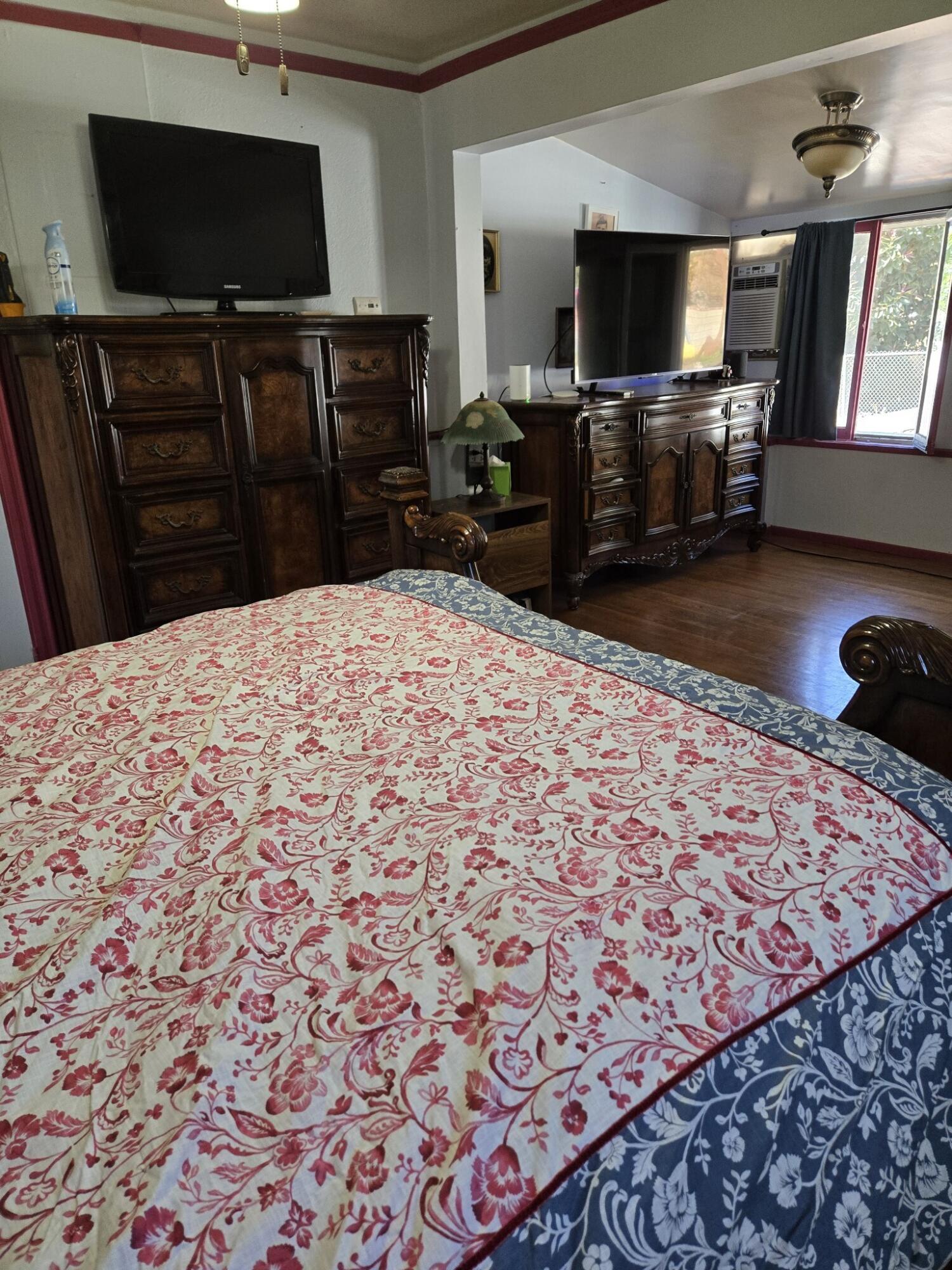 13429 Bailey Street Whittier, CA 90601 - Photo 28 of 54 a bedroom with a bed and a flat screen tv