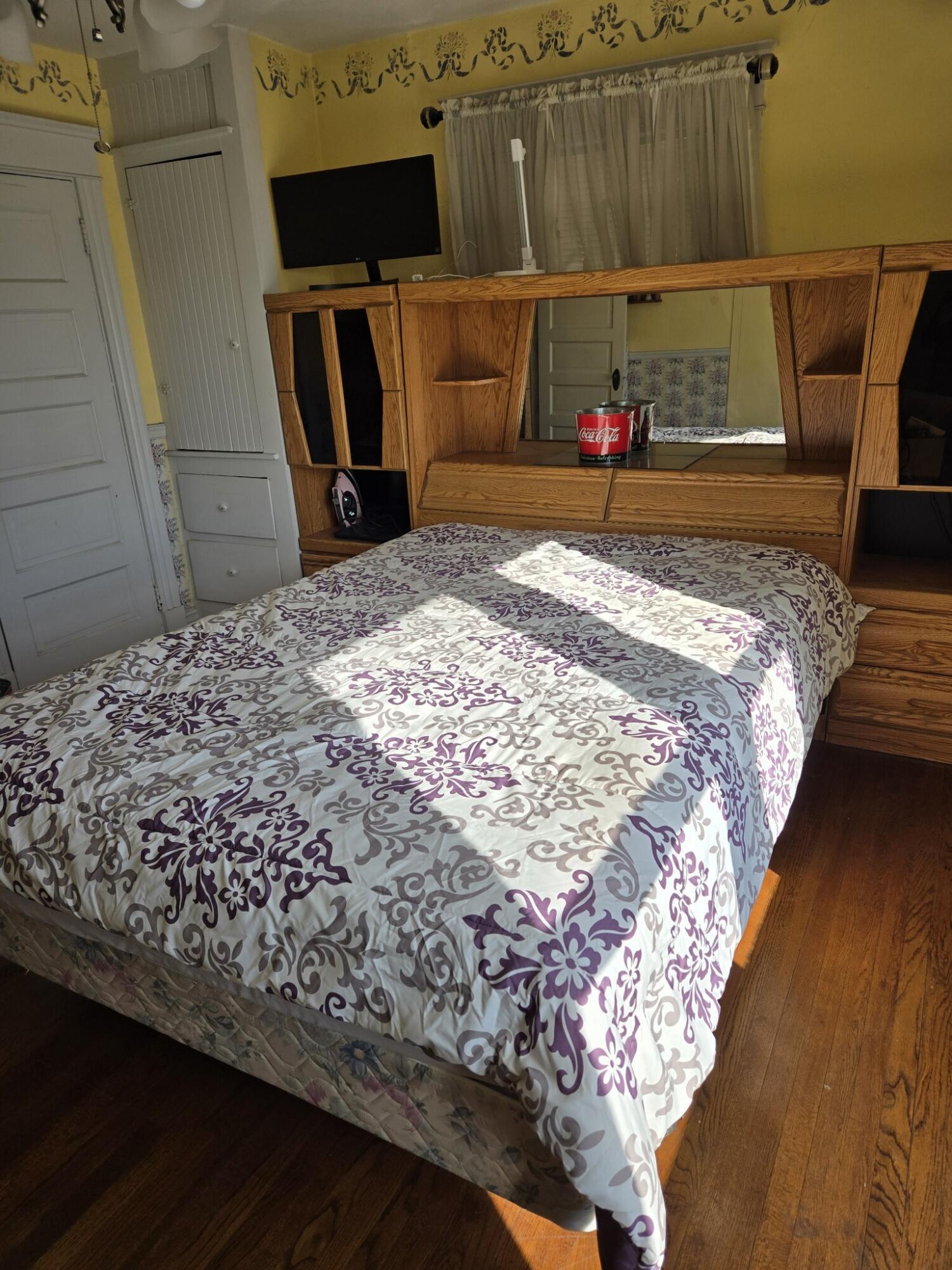 13429 Bailey Street Whittier, CA 90601 - Photo 34 of 54 a bed sitting in a bedroom next to a window