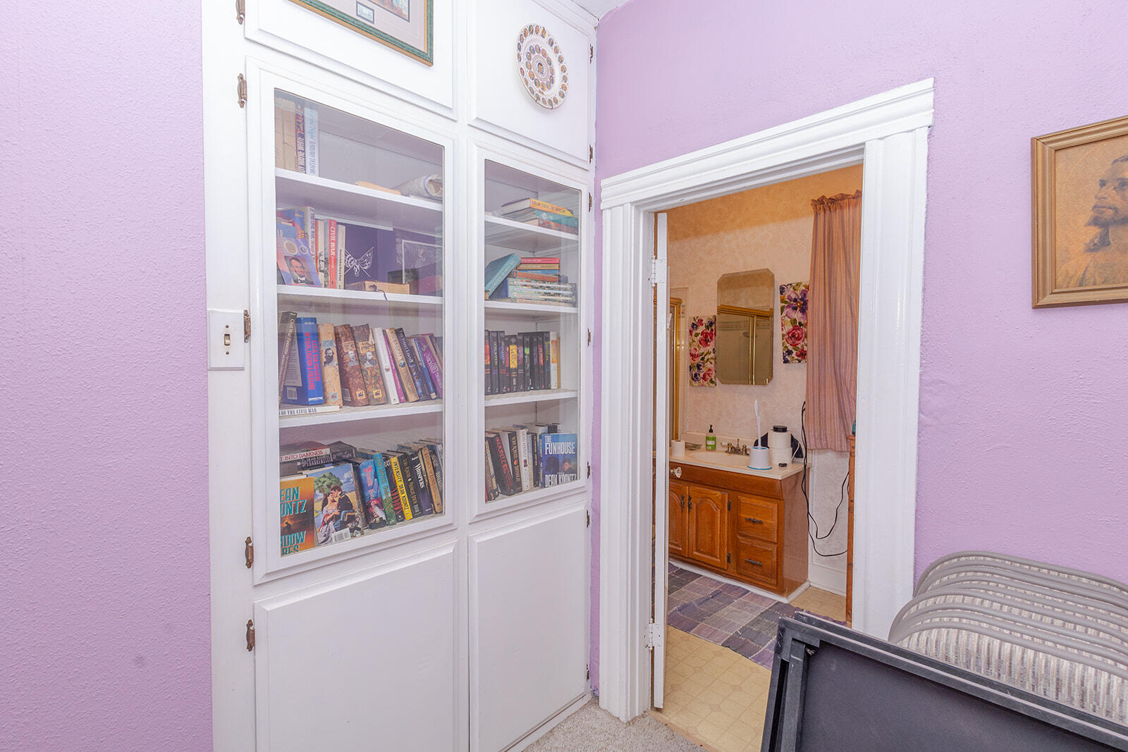 13429 Bailey Street Whittier, CA 90601 - Photo 36 of 54 a room with furniture and a book shelf