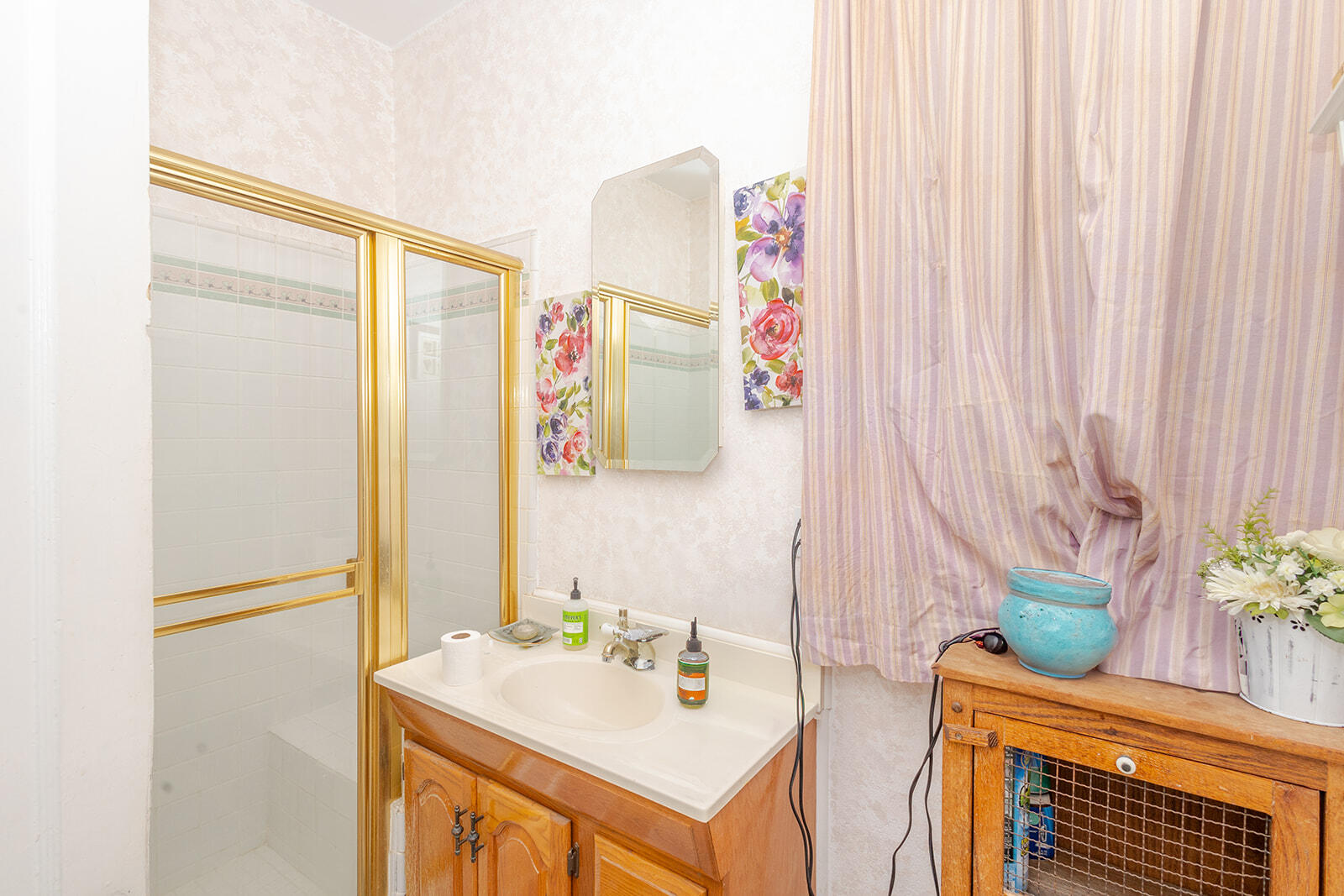 13429 Bailey Street Whittier, CA 90601 - Photo 38 of 54 a bathroom with a sink a mirror and a shower curtain