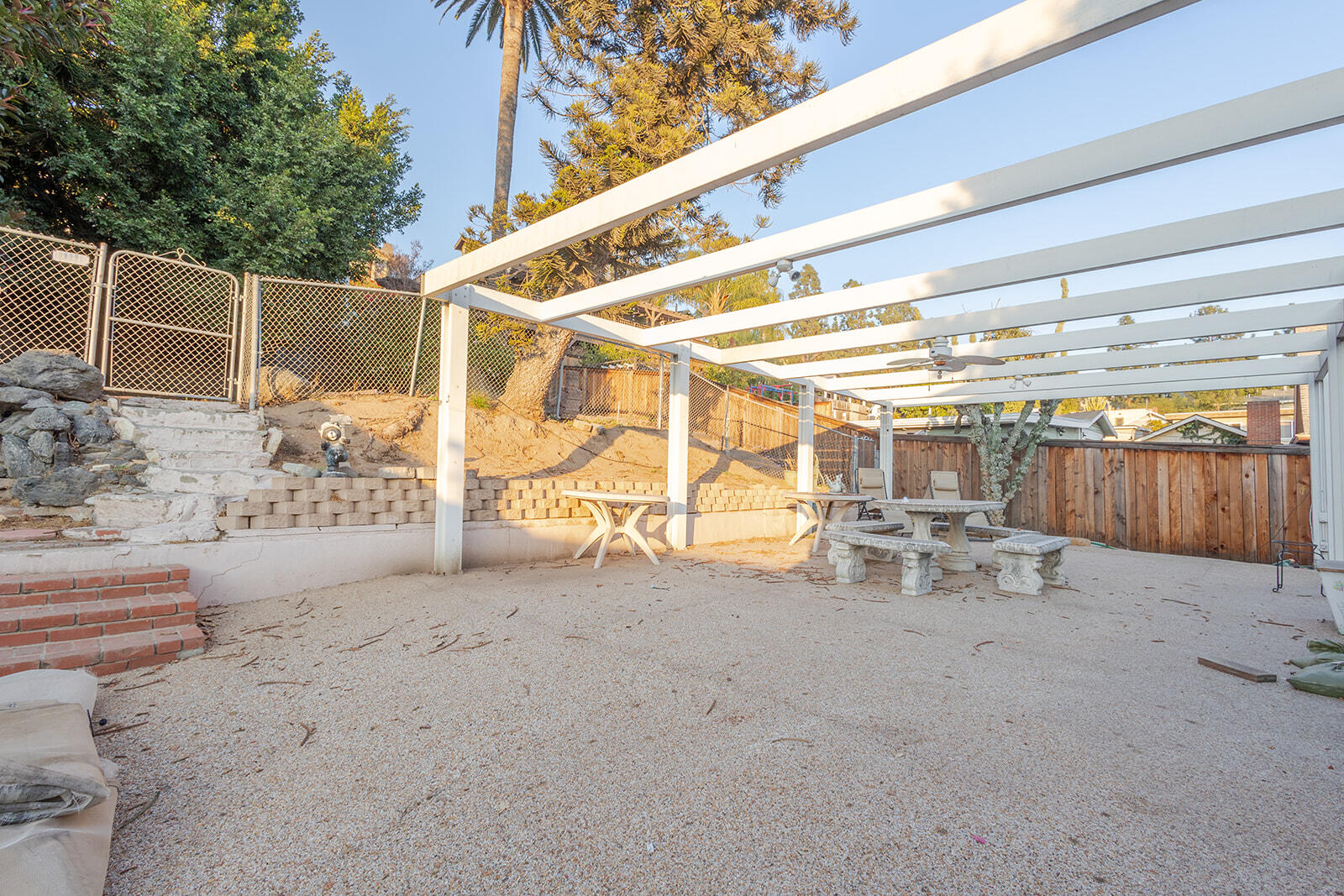 13429 Bailey Street Whittier, CA 90601 - Photo 48 of 54 a view of a patio with table and chairs and potted plants
