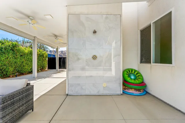 a view of a terrace with a big yard