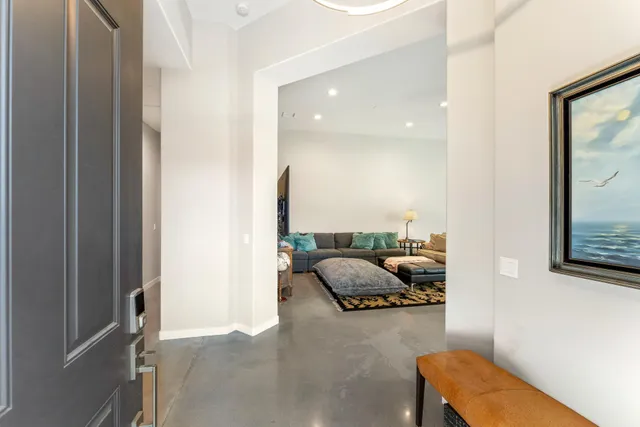 a kitchen with stainless steel appliances granite countertop a sink a stove and a refrigerator