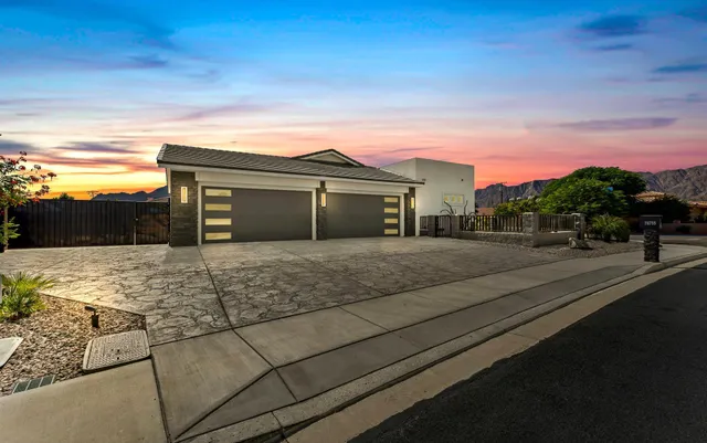a view of house with a yard and balcony