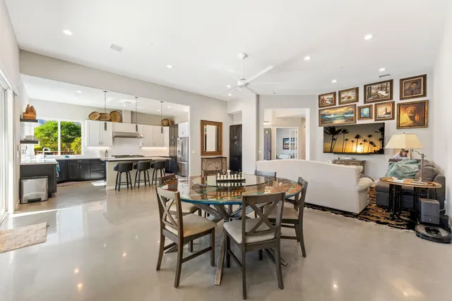 a spacious bathroom with a double vanity sink a mirror and a shower