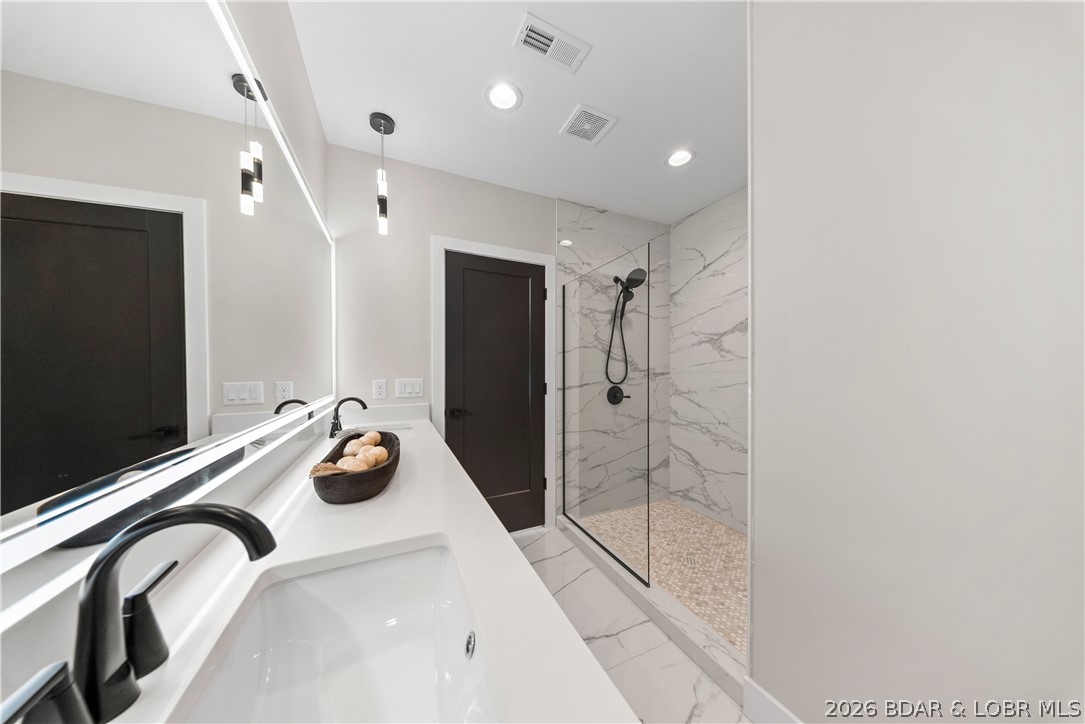 439 Red Bud Road Lake Ozark, MO 65049 - Photo 56 of 98 Another view of the spacious guest bathroom showca
