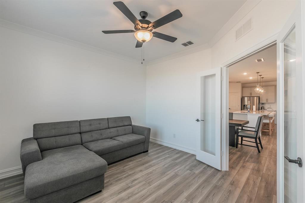 4305 Noble Lane Midlothian, TX 76065 - Photo 16 of 40 a living room with furniture and a wooden floor