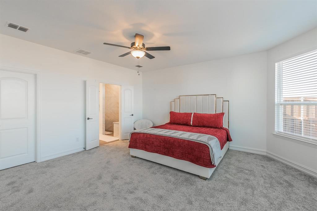 4305 Noble Lane Midlothian, TX 76065 - Photo 24 of 40 a bedroom with a bed and a window