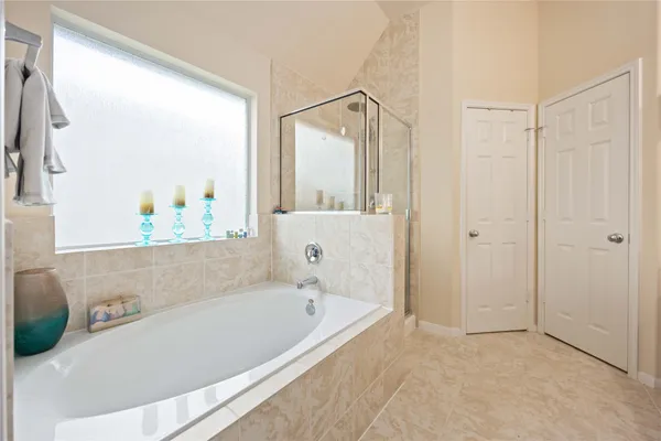 a bathroom with a bathtub and a shower