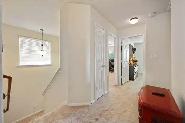 a view of room with window and hallway