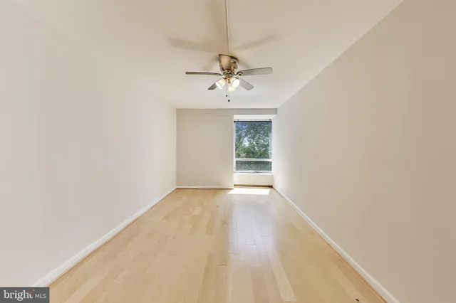 a view of an empty room with a bathroom