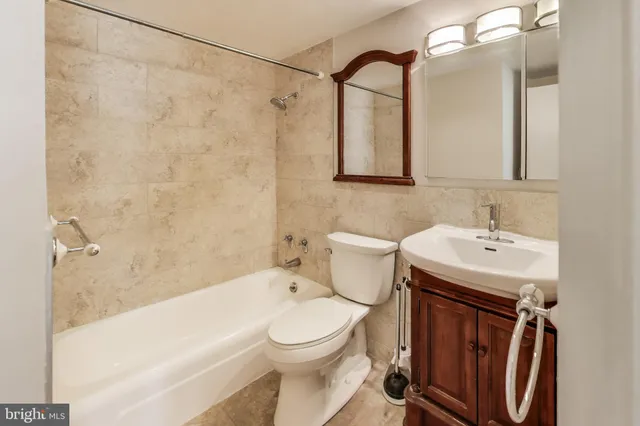 a view of a room with lots of furniture and baby crib