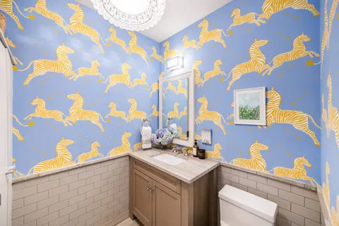 a kitchen with a sink and a mirror