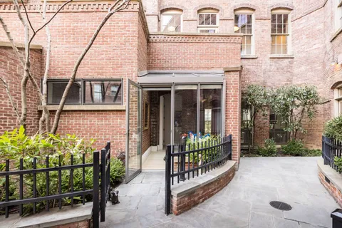 front view of a house with a small yard