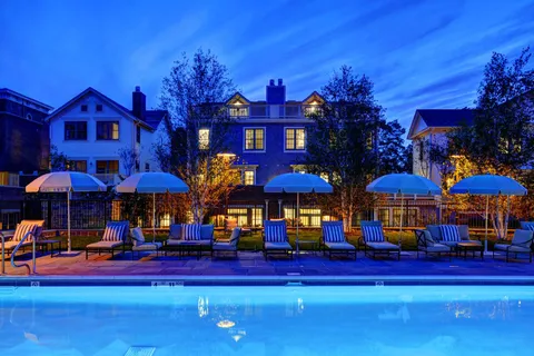 a view of a livingroom with workspace and a window