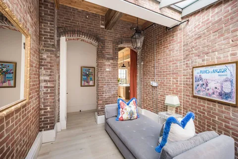 a view of a couches and table in the patio