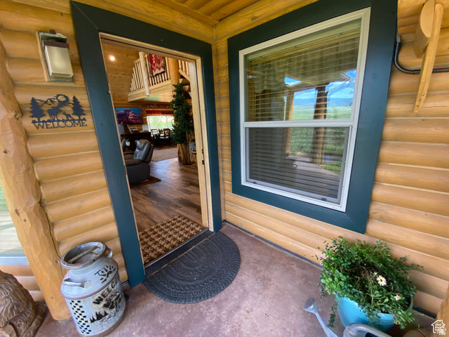 79 Auburn Forest Road Auburn, WY 83111 - Photo 14 of 76 Property entrance with faux log siding