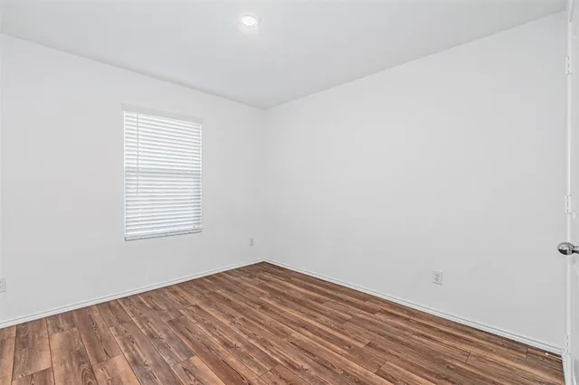 a bathroom with a sink toilet and a mirror