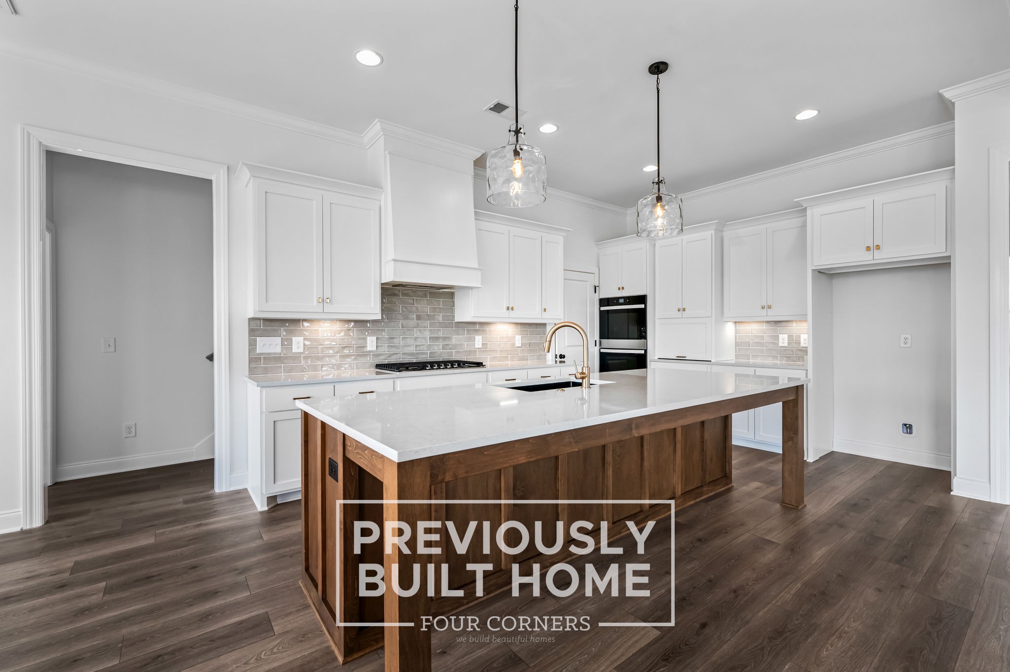 4209 McCown Way Murfreesboro, TN 37127 - Photo 13 of 34 a kitchen with stainless steel appliances granite countertop a stove a refrigerator a sink dishwasher and a dining table with wooden floor