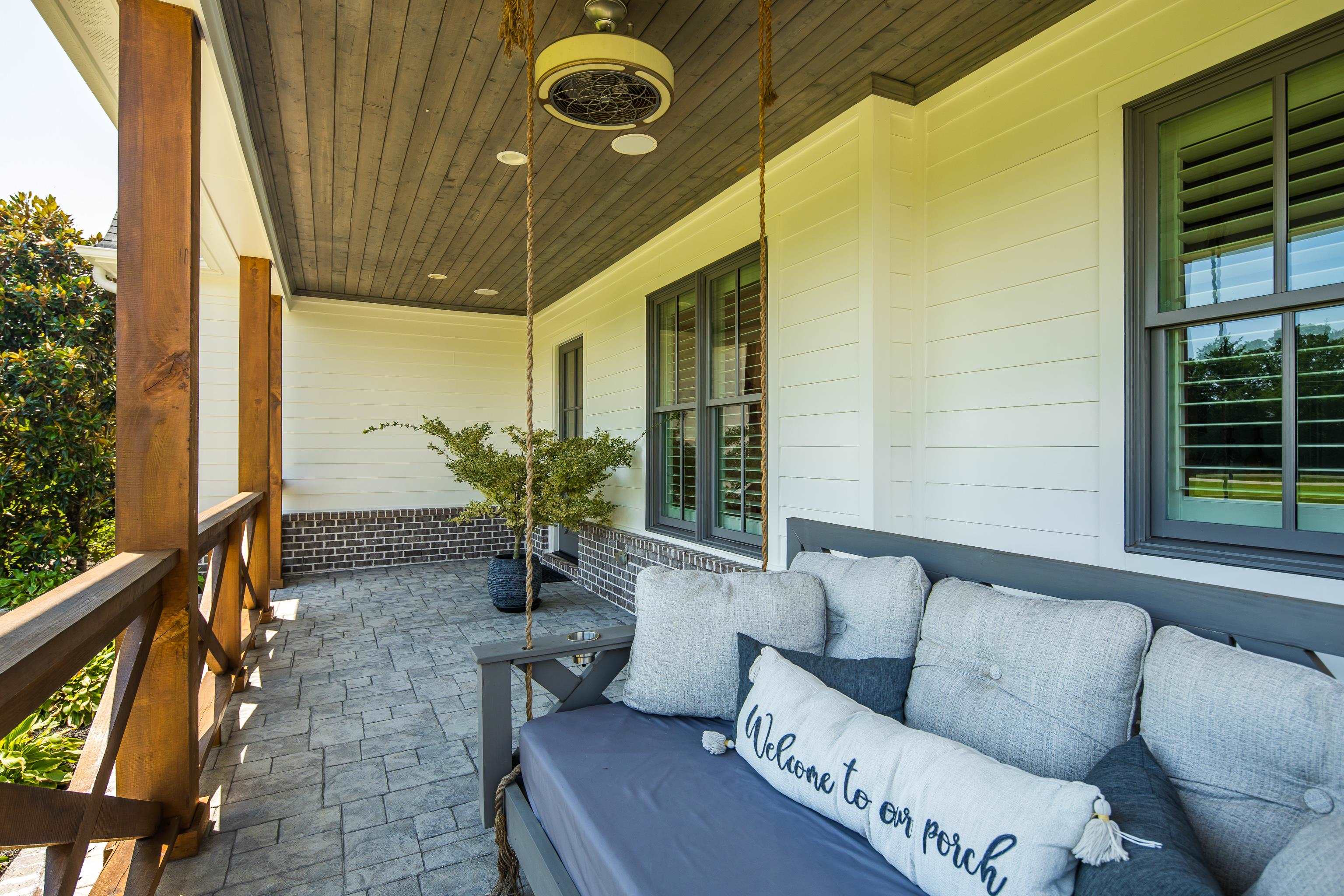 805 Shady Grove Road Williston, TN 38076 - Photo 5 of 40 Covered porch featuring a wood plank ceiling, exposed wood posts and railing, a brick half-wall, and paver flooring