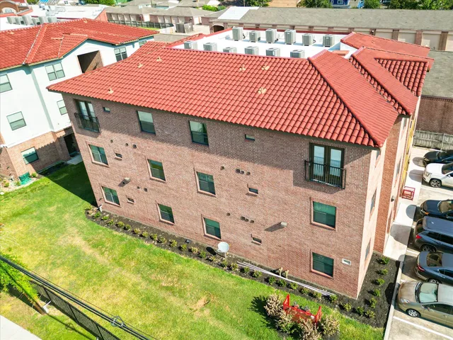 aerial view of a house with a yard