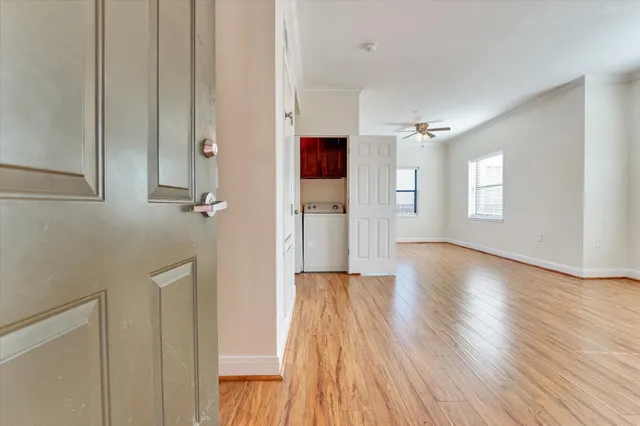 a view of livingroom with hardwood floor and hallway