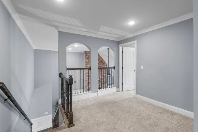 a living room with furniture a table and a flat screen tv