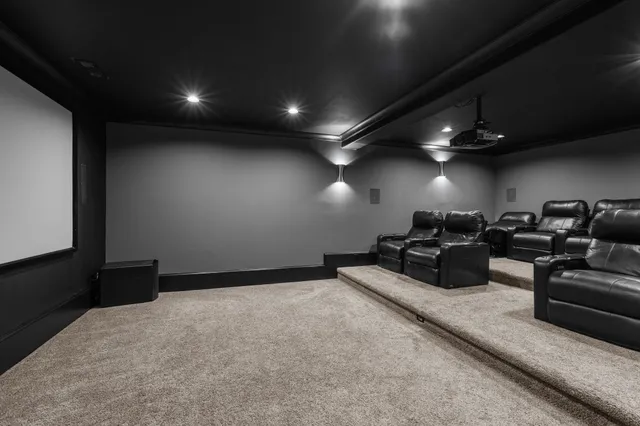 a room with furniture pool table wooden floor and windows