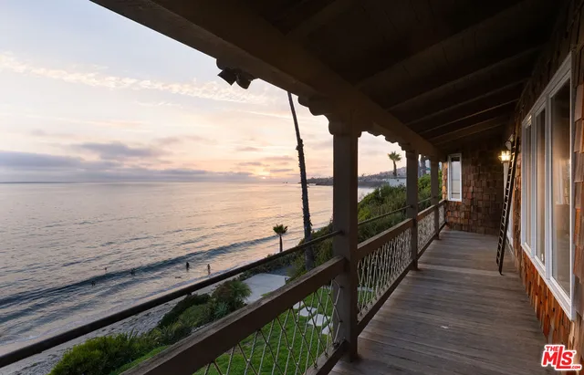 a view of a balcony with ocean view