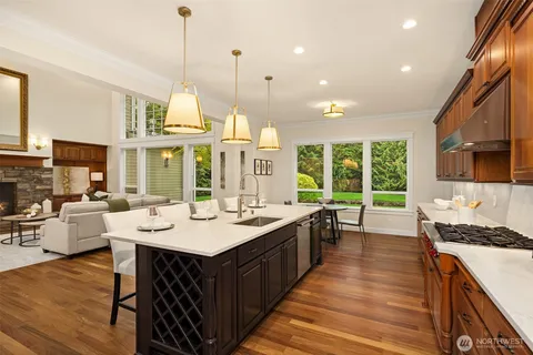 a large kitchen with lots of counter space and windows