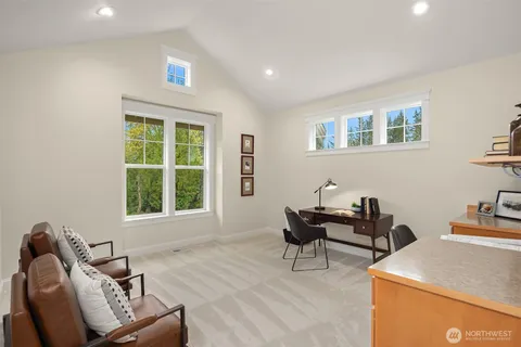 a bedroom with furniture and a window