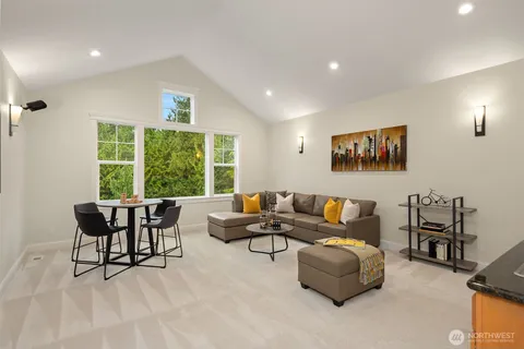 a living room with furniture and a breakfast area