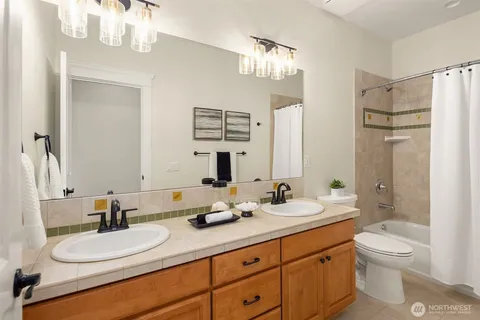 a kitchen with a sink stove top oven and cabinets