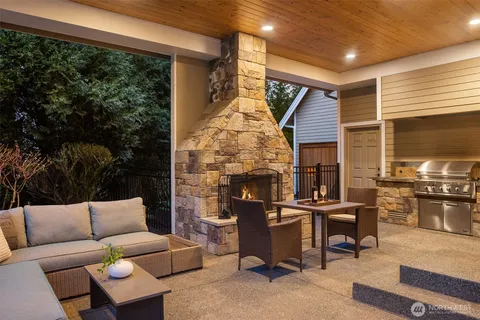 a backyard of a house with outdoor seating