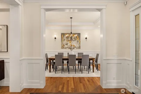 a view or dining room with furniture window and wooden floor