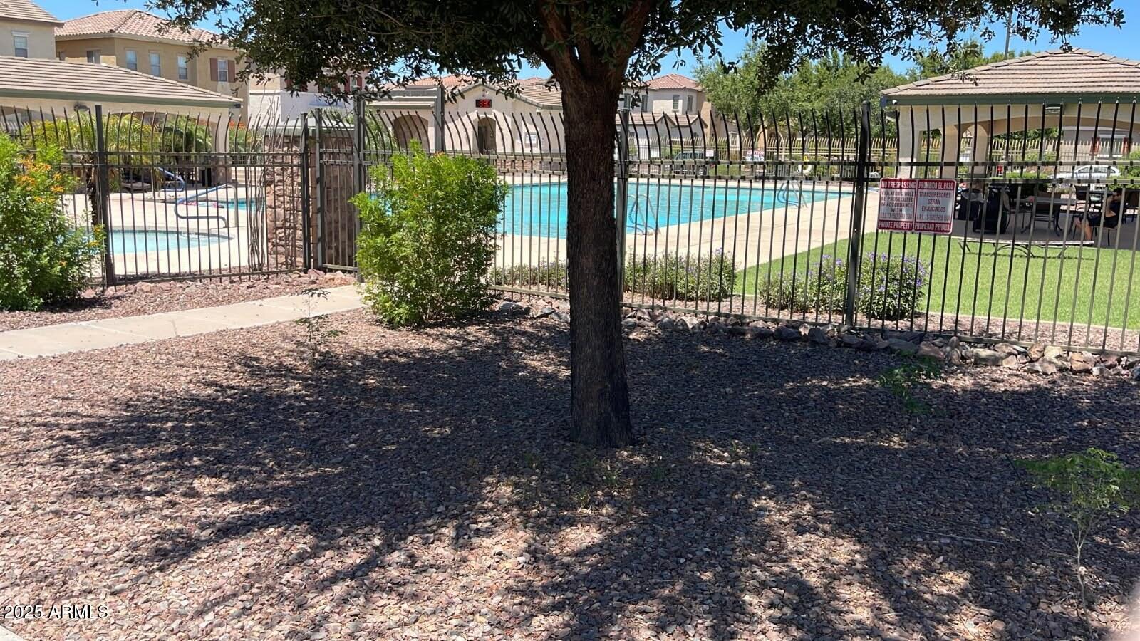 4717 East Redfield Road Gilbert, AZ 85234 - Photo 13 of 13 a view of a yard in front of a building