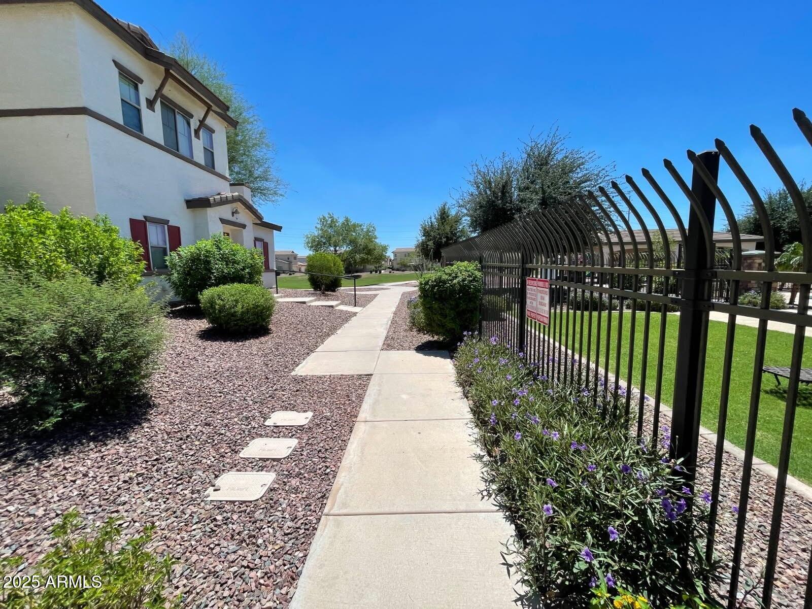 4717 East Redfield Road Gilbert, AZ 85234 - Photo 2 of 13 a view of a garden with pathway