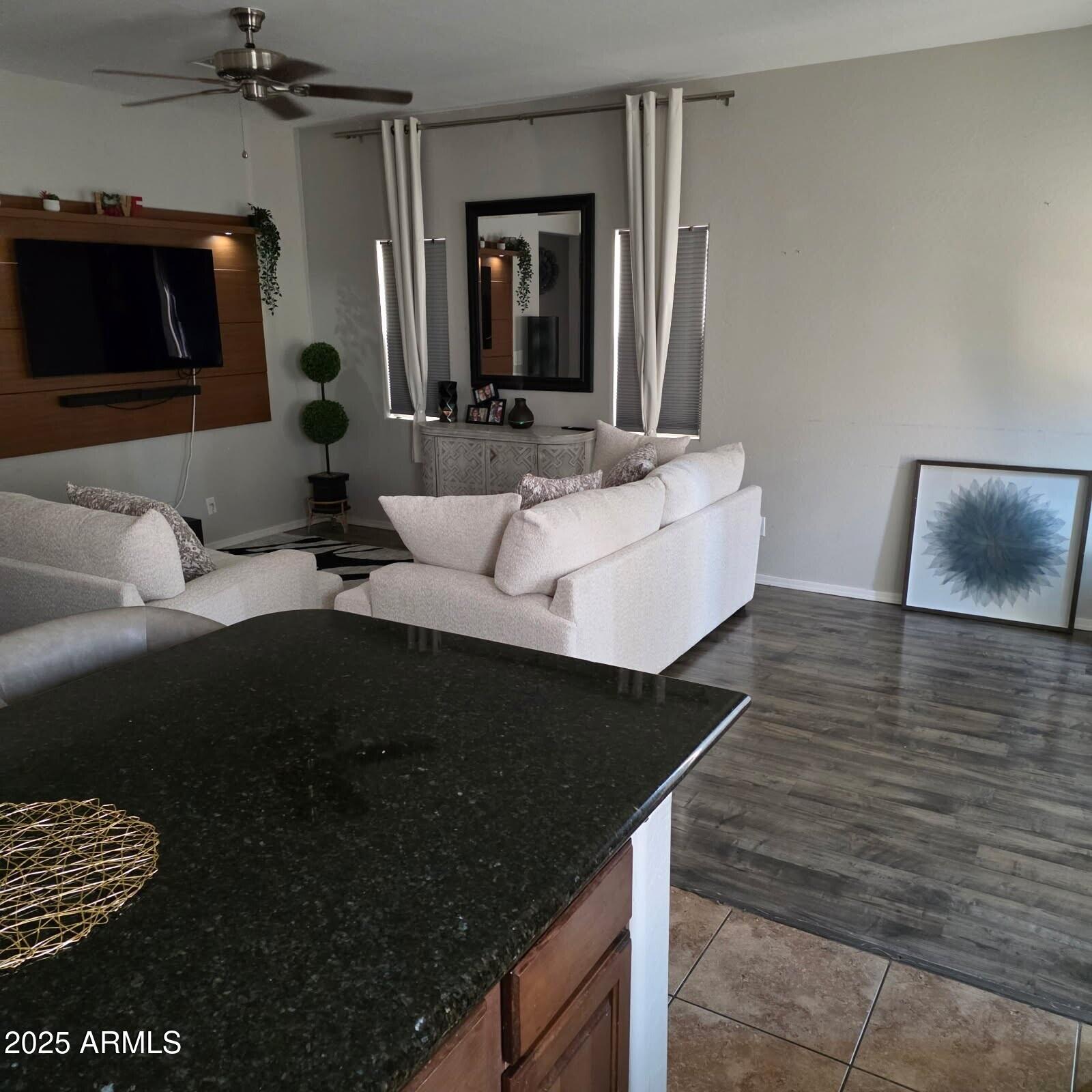 4717 East Redfield Road Gilbert, AZ 85234 - Photo 4 of 13 a living room with furniture and a flat screen tv